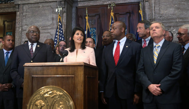 South Carolina Gov. Nikki Haley along with Sens. Tim Scott and Lindsey Graham (right, far right) and other lawmakers and activists call for the Confederate flag to be moved from state Capitol grounds. Joe Raedle/Getty Images