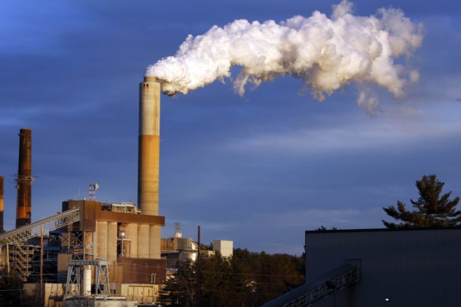 A plume of steam billows from the coal-fired Merrimack Station in Bow, N.H. in January 2015. Jim Cole/AP