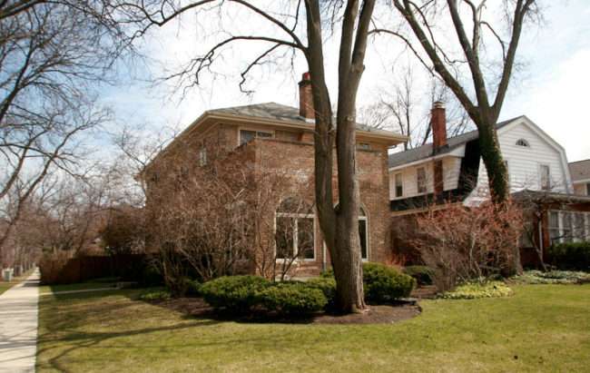 Hillary Clinton's father, Hugh Rodham, paid for his family's home on Wisner Street in Park Ridge, Ill. outright, with money he had saved as the owner of a drapery business. The house is on the corner. It's brick, two stories tall under big shade trees. (Photo by Tamara Keith/NPR)