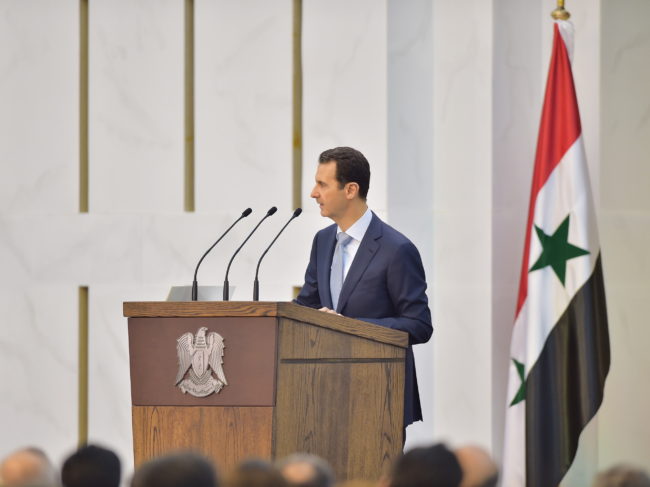 Syrian President Bashar Assad speaks during his meeting with the heads and members of public organizations and professional associations in Damascus, on Sunday. Assad acknowledged that the fight against rebels had suffered setbacks, but vowed to win against insurgents. SANA/Reuters