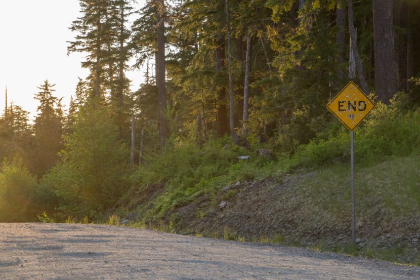 A shot-up sign marks the end of the road in Juneau, May 25, 2015. The road would be extended about 50 miles under a state plan that's on hold.