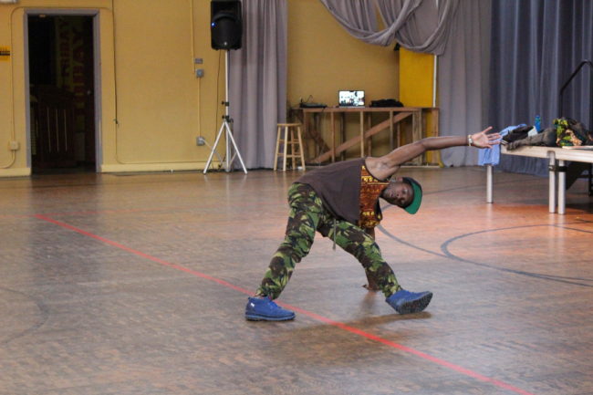 Fahad Kiryowa shows a class how to master the basic moves of breakdance. (Photo by Elizabeth Jenkins/KTOO)