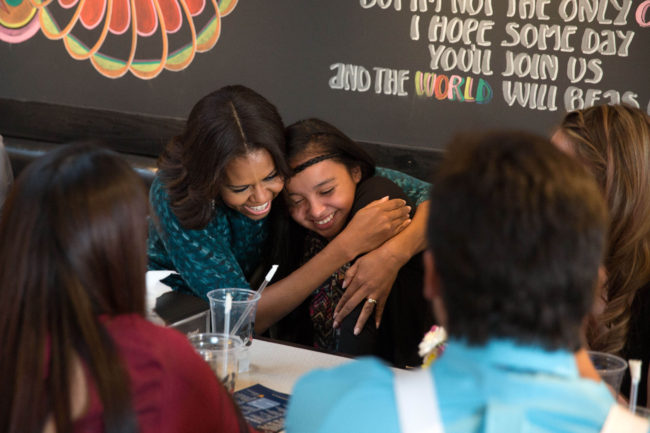 First Lady Michelle Obama hugs a lunch guest as she and President Barack Obama have lunch with youth from the Standing Rock Sioux Tribe in Washington, D.C., Nov. 20, 2014. (Official White House Photo by Pete Souza)