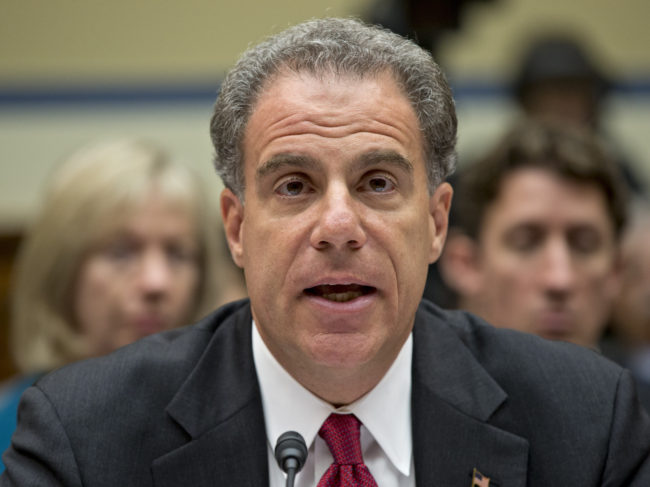 Michael Horowitz, the Justice Department's inspector general, testifies before a House committee in 2012 critical of the department's "Operation Fast and Furious." Thursday, he said a legal opinion from the department could block his office from getting documents crucial to his watchdog role. J. Scott Applewhite/AP