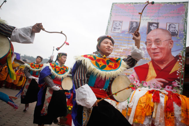 Tibetan men living in Kathmandu, Nepal, danced Monday during celebrations to mark the 80th birthday of the Dalai Lama. Niranjan Shrestha/AP