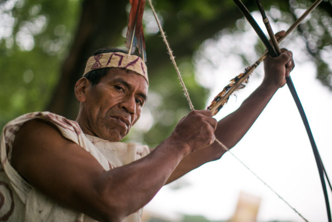 Victorio Dariquebe Gerewa displays his bow and arrow at the Smithsonian Folklife Festival in Washington, D.C. Ben de la Cruz/NPR