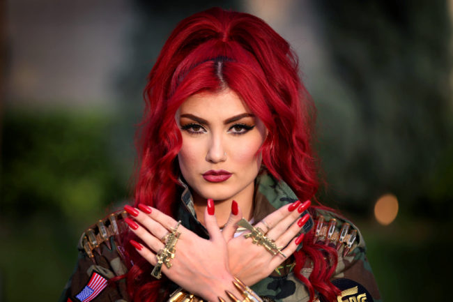 Iraqi Kurdish singer Helly Luv sings in support of Kurdish fighters, called the peshmerga, who are battling the Islamic State. Her songs are popular among Kurds in northern Iraq, though some critics say her outfits and dancing are un-Islamic. Safin Hamed/AFP/Getty Images