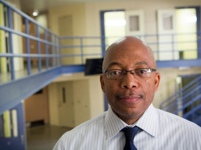 Brian Hopson, assistant superintendent at Alameda County Juvenile Hall, stands in one of its many empty units. The 360-bed facility was full when it opened eight years ago, but is now at half capacity. Brett Myers/Youth Radio