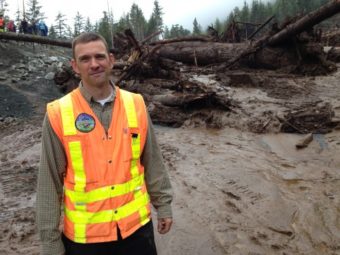 City engineer David Longtin is back working at the landslide that nearly overtook him Tuesday. Longtin is not totally at ease — “I’m keeping my eye on it,” he says. (Photo by Robert Woolsey/KCAW)