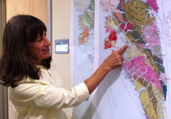 Susan Karl points to fauls shown on a new geologic map of Baranof Island, in Southeast Alaska. It reflects the discovery that the island's bedrock is different from that of other parts of the region. (Ed Schoenfeld/CoastAlaska News)