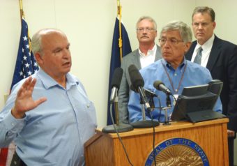 8-26-15 B.C. Mines Minister Bill Bennett discusses the week's mine meetings as Lt. Gov. Byron Mallott and other state officials listen during a Wednesday press conference. (Photo by Ed Schoenfeld, CoastAlaska News)