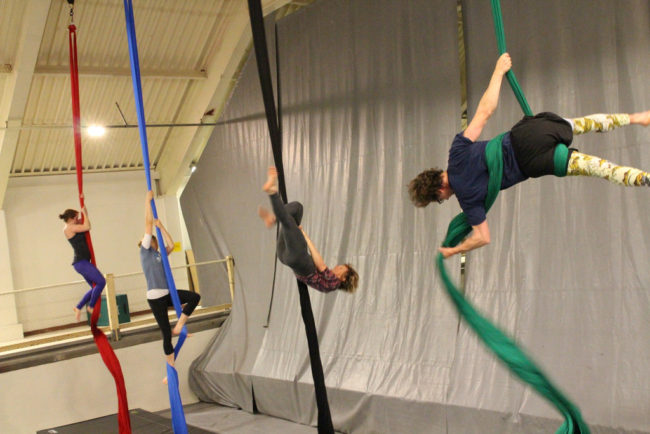 Some students come to circus with prior training in dance, yoga, or climbing. But many are new to the aerial arts. (Photo by Emily Kwong/KCAW photo)