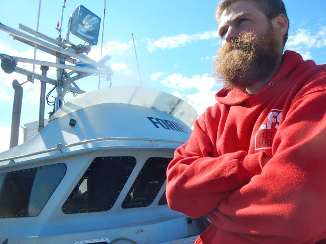 Mihey Basargin of Wasilla on the docks in Dutch Harbor after being rescued. (Photo by John Ryan/KUCB)
