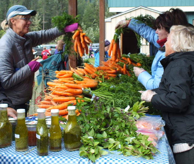 Carrots are going fast at the Farmer's Market. (Photo by Matt Miller/KTOO)