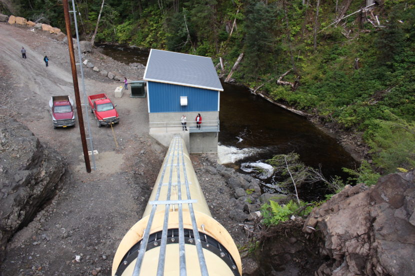 Water flows down the tube and spins a turbine that creates electricity. (Photo by Elizabeth Jenkins/KTOO)