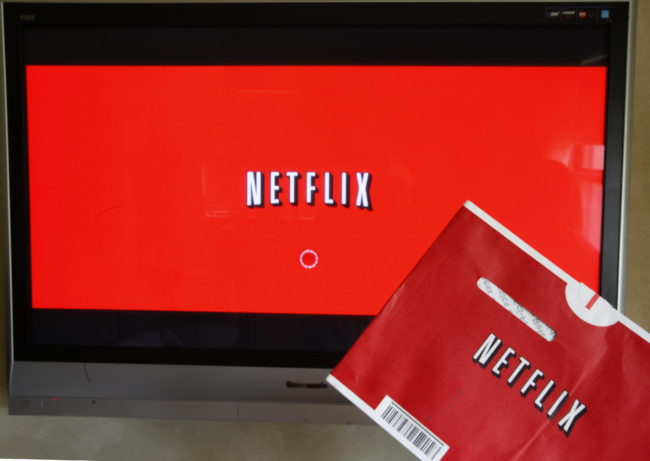 NPR has learned that Netflix's new policy of year-long parental leave applies to employees of its streaming business, but not those in Netflix DVD distribution centers. Wilfredo Lee/AP
