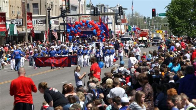 People gather for the annual McPherson County All Schools Day parade. Kansas is among the states seeking to counter shrinking population in rural counties with tax incentives and other programs. (AP)