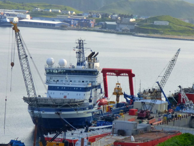 The Fennica and its yellow capping stack in Alaska’s Dutch Harbor on July 18. (Photo by John Ryan/KUCB)