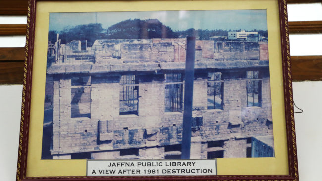 This framed picture depicts the library in 1981, after it was destroyed in a fire that Sri Lankan Tamils suspect was set by government police. Julie McCarthy/NPR