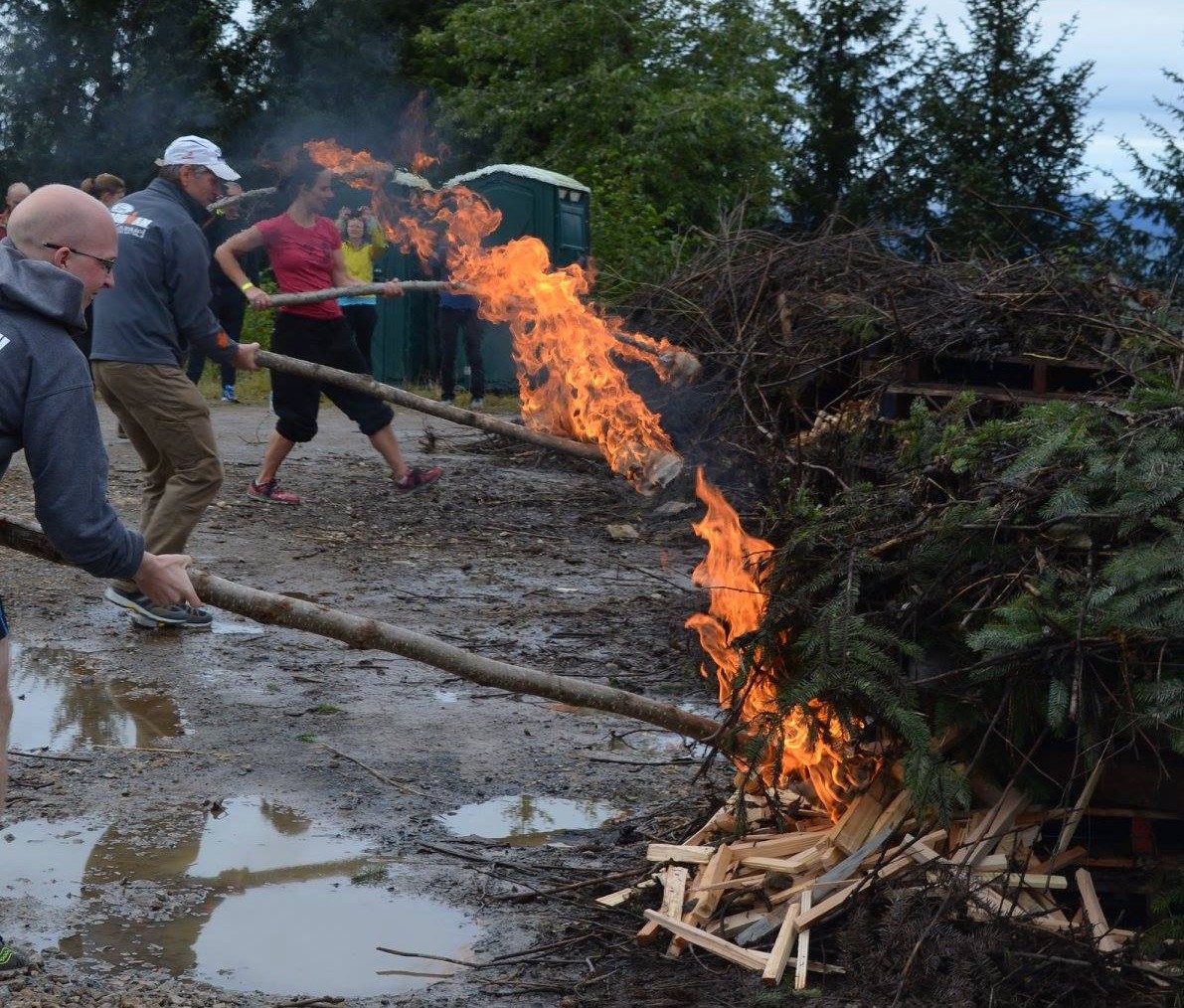The winner's of the 2015 J'eet's Challenge race in Hoonah light signal fires near the finish line, Aug. 29, 2015. (Photo courtesy Icy Strait Point)