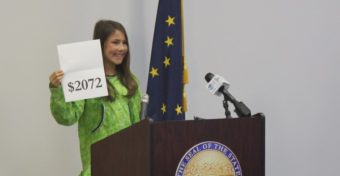 Palmer Jr. Middle School 7th grader, Shania Sommer, 12, announced the amount of the 2015 Permanent Fund Dividend. (Photo by Josh Edge/APRN)