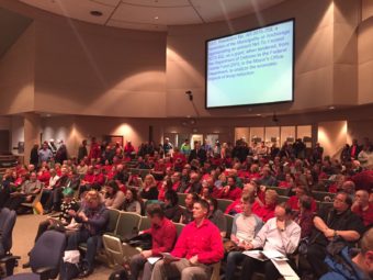 Mobilized by a coalition of faith groups, opponents of the measure wore red. (Photo by Zachariah Hughes/KSKA)