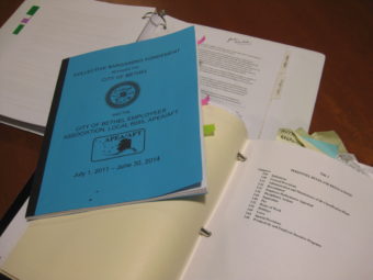 The City’s Municipal Code, Union Agreement, and Employee Handbook, which the City Administrator and City Attorney are creating drafts of to include “sexual orientation” and “gender identity” under protected classes. (Photo by Anna Rose MacArthur/KYUK)
