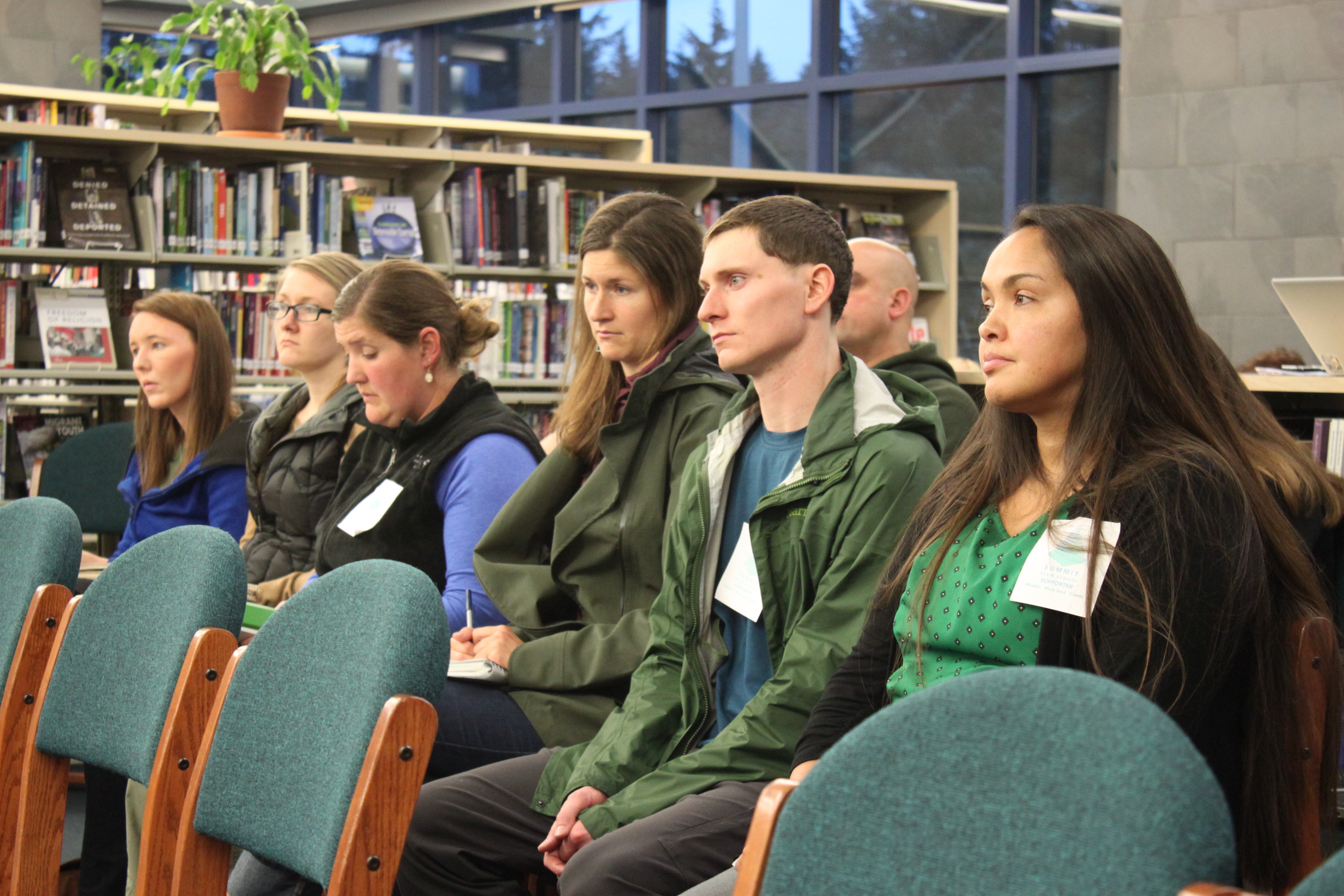 Summit STEM School supporters and organizers sit in the audience of Tuesday's regular School Board meeting. (Photo by Lisa Phu/KTOO)