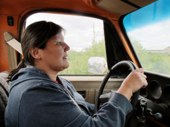 Valerie Davidson, Alaska's health and social services commissioner, drives her 1983 Chevy truck to pick up salmon for a dinner party for 50 people. (Photo by Annie Feidt/APRN)
