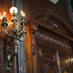 Ornate woodwork, granite moldings and antique chandeliers gleam like new.