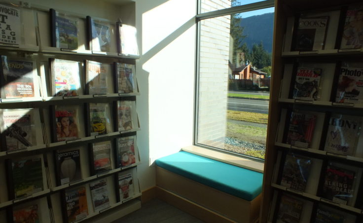 The periodical section features a window alcove for seating (Photo by Matt Miller/KTOO)