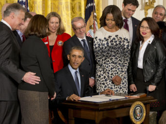 President Barack Obama signs the Clay Hunt Suicide Prevention for American Veterans Act, named for a Marine Corps combat veteran who struggled with post-traumatic stress disorder after serving in Iraq and Afghanistan and who killed himself in March 2011 at the age of 28. The bill calls for evaluation and expansion of existing Veterans Affairs mental health and suicide prevention programs. J. Scott Applewhite/AP