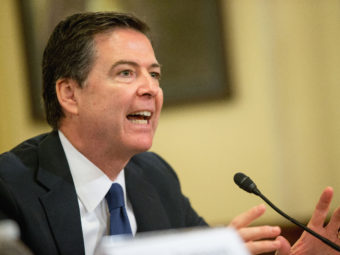 FBI Director James Comey says police restraint, born from increased scrutiny in the wake of high-profile police killings and evidence of racial bias, may be contributing to an uptick in violent crimes in some cities. Andrew Harnik/AP