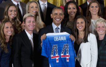 President Obama poses with a jersey he received from the U.S. Women's National Soccer Team during a ceremony to honor the team and their victory in the 2015 FIFA Women's World Cup. Standing with Obama are (from left) Christie Rampone, Morgan Brian, Abby Wambach, Julie Johnston, Sydney Leroux, Carli Lloyd, Alex Morgan, and Megan Rapinoe. Carolyn Kaster/AP