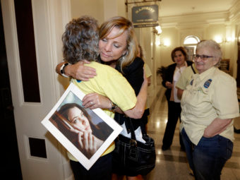 Debbie Ziegler holds a photo of her late daughter, Brittany Maynard, after the California State Assembly approved a right-to-die measure on Sept. 9. Maynard died on Nov. 1, 2014. Rich Pedroncelli/AP
