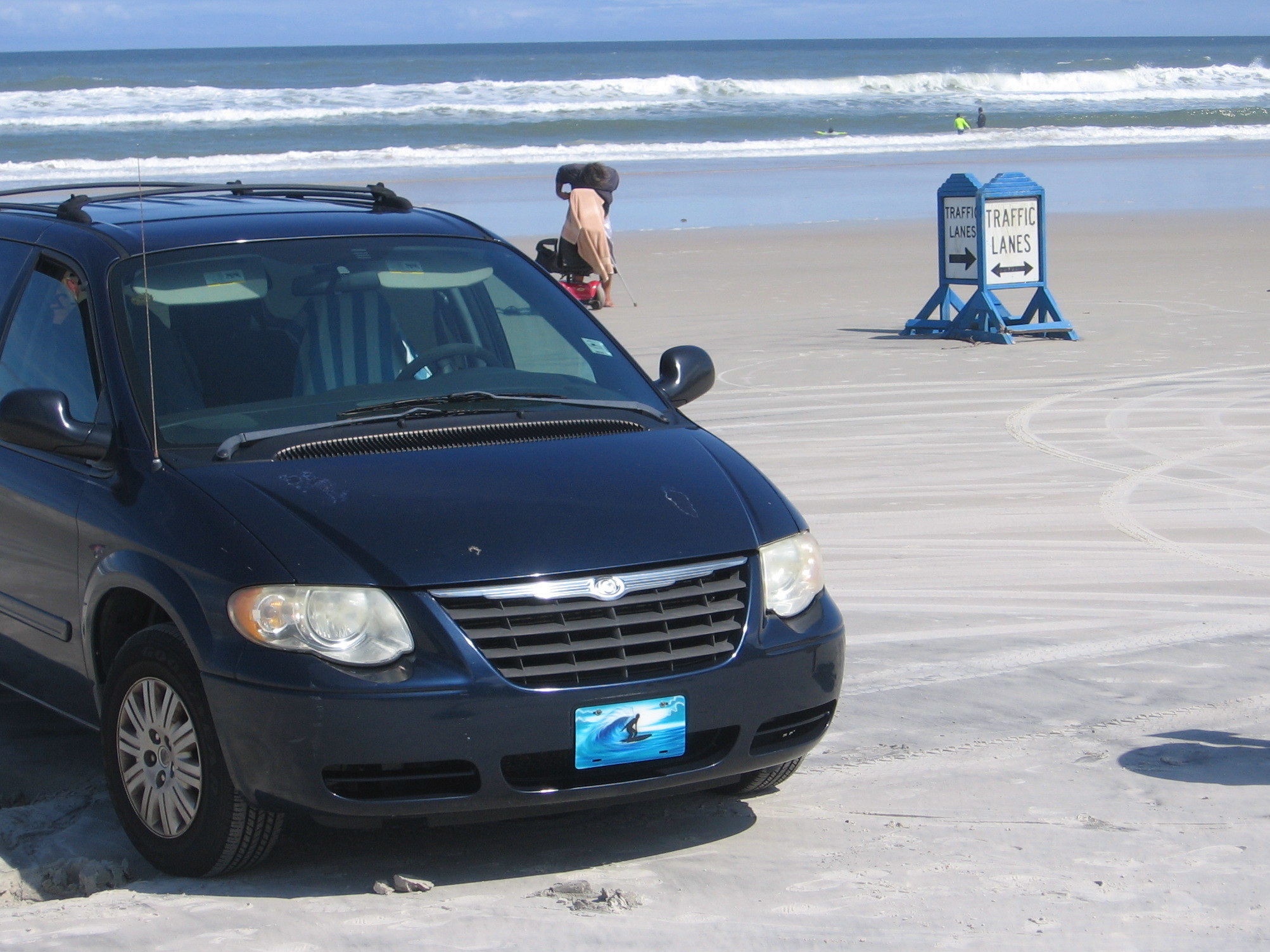 To minimize confusion, many beaches in Volusia county have signs to differentiate lanes for cars and trucks on the sand. (Photo by Greg Allen/NPR)
