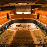 The Blue Whale auditorium (pictured still under construction) seats 1,750 in three tiers, with a stage suitable for symphony concerts backed by a pipe organ.