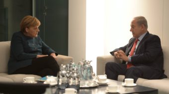 German Chancellor Angela Merkel meets with Israeli Prime Minister Benjamin Netanyahu in Berlin on Wednesday. Amos Ben Gershom/Israeli Government Press office