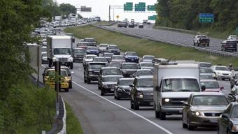 Vehicles are pulled off on the shoulder during bad traffic congestion, on Interstate 495 outside of Washington. Maryland and D.C. have issued regulations to prevent individual consumer data from being used to set insurance rates. AP