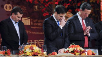 Republican U.S. presidential candidates Ted Cruz, Marco Rubio and Rick Santorum pray at the Presidential Family Forum in Des Moines, Iowa, November 20, 2015. The question of how to treat Syrian refugees has evoked different reactions in political evangelicals. Mark Kauzlarich/Reuters