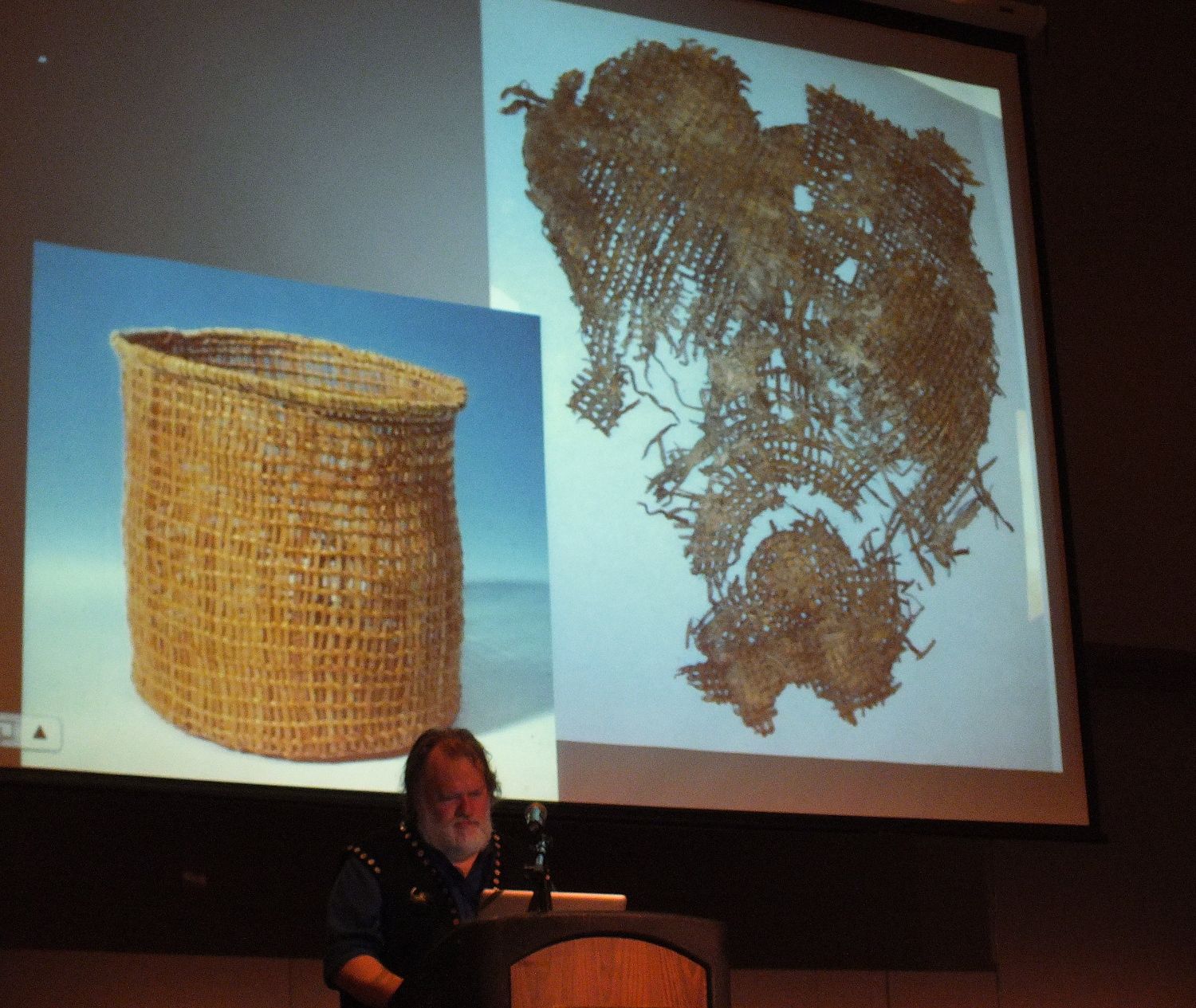 State curator of collections Steve Henrikson highlights a 6,000 year old recovered basket fragment (right) and a replica (left) made by noted basket weaver Delores Churchill. (Photo by Matt Miller/KTOO)