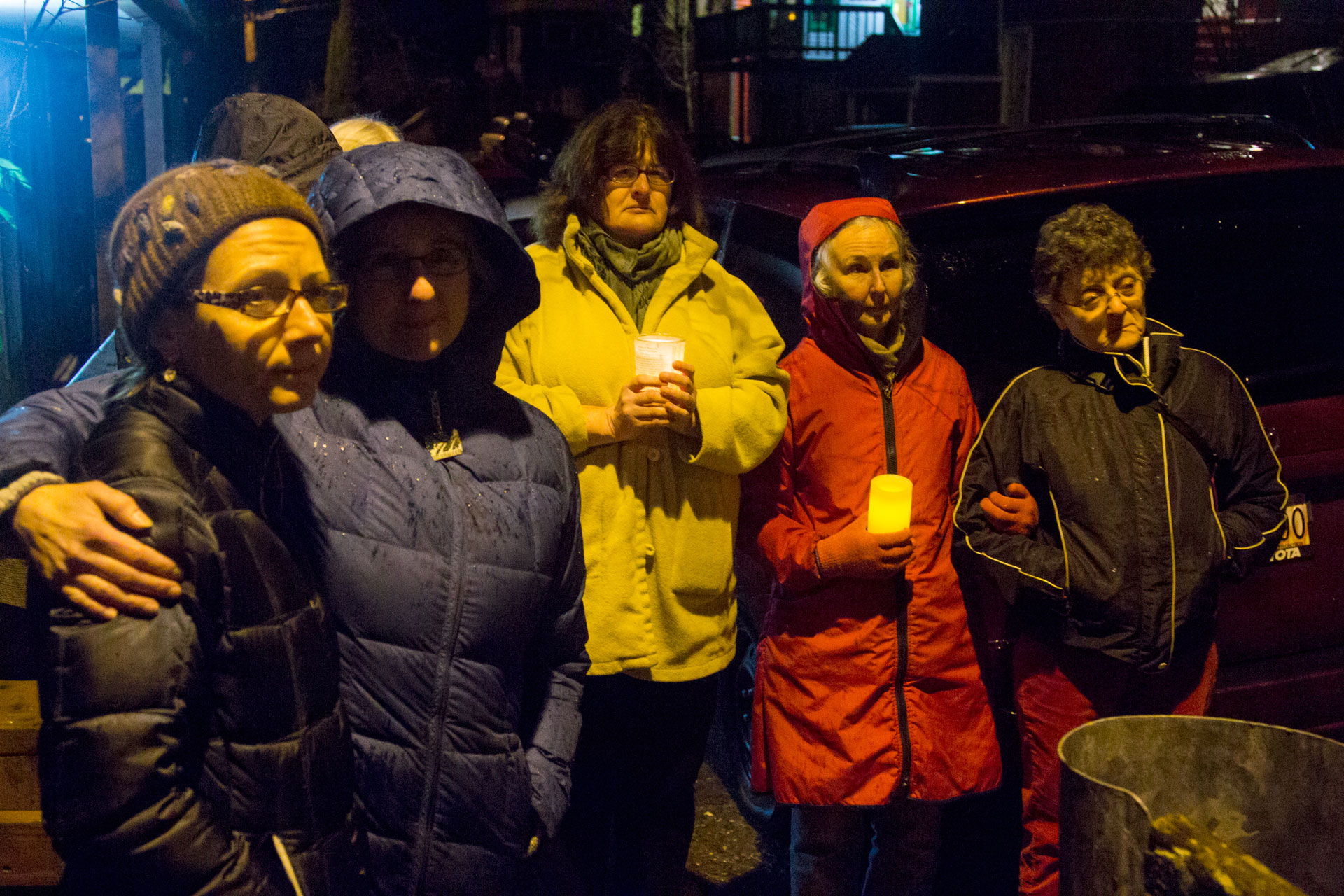 Neighbors gathered to remember Mayor Greg Fisk on Monday evening. They stood in silent respect, holding candles, as Fisk's body was removed from his home on Kennedy Street. (Photo by Mikko Wilson/KTOO)