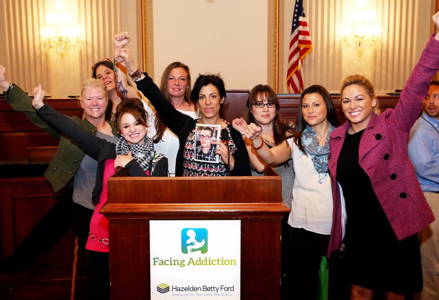 Alaskans were part of the UNITE to Face Addiction Rally in Washington, D.C.: Kim Whitaker, Julee Douglas, Samantha Garton, Terria Walters, Kara Nelson, Delia Williams, Jennifer Mcallister and Christina Love inside a congressional office building in D.C. in October. Nelson is holding a picture of Christopher Seaman, the son of Walters who was murdered in Mat-Su in June. (Photo courtesy Kara Nelson)