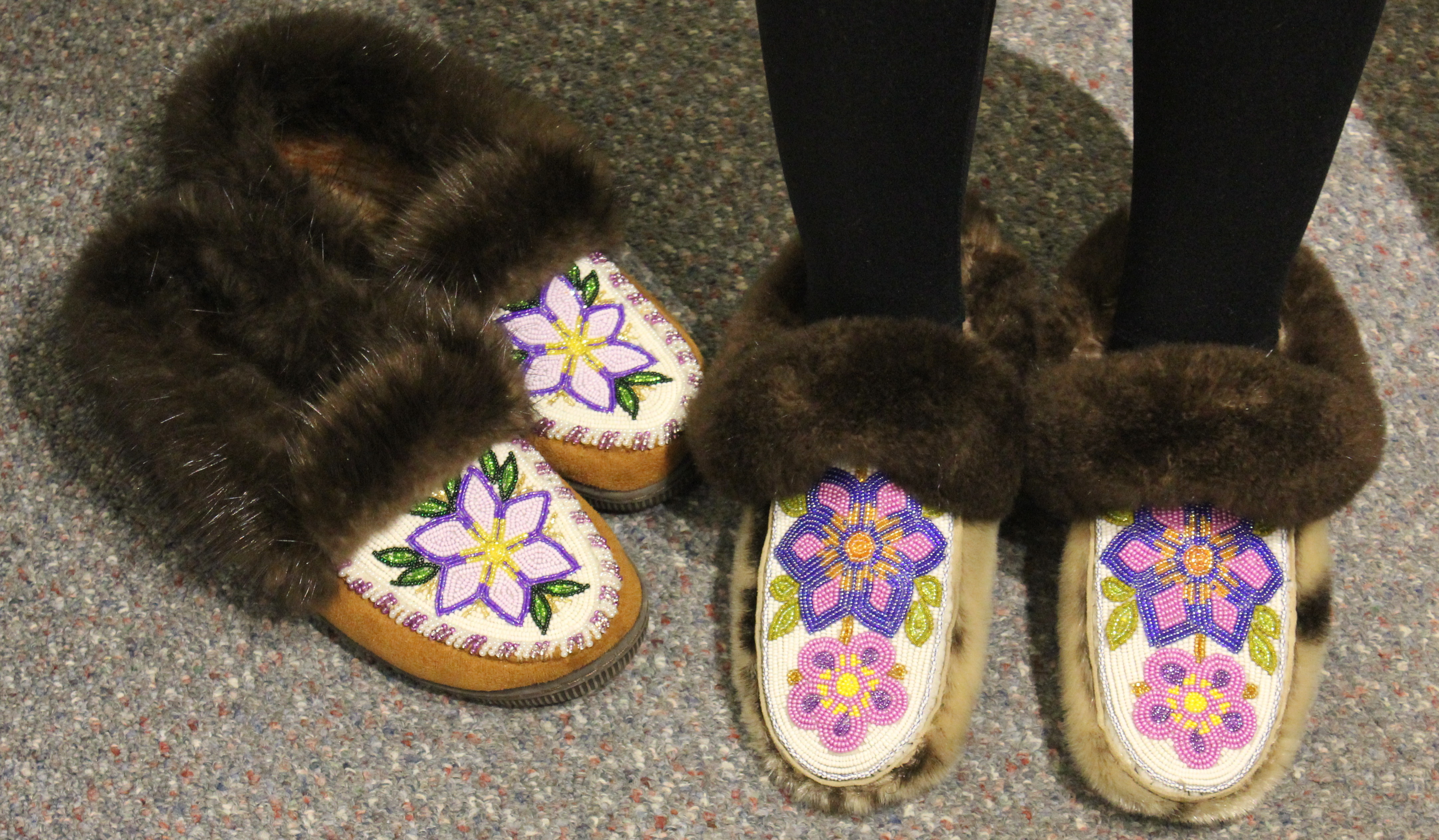 Two pairs of moccasins Crystal Nelson has worn for Rock Your Mocs 2015 (Photo by David Purdy/KTOO)