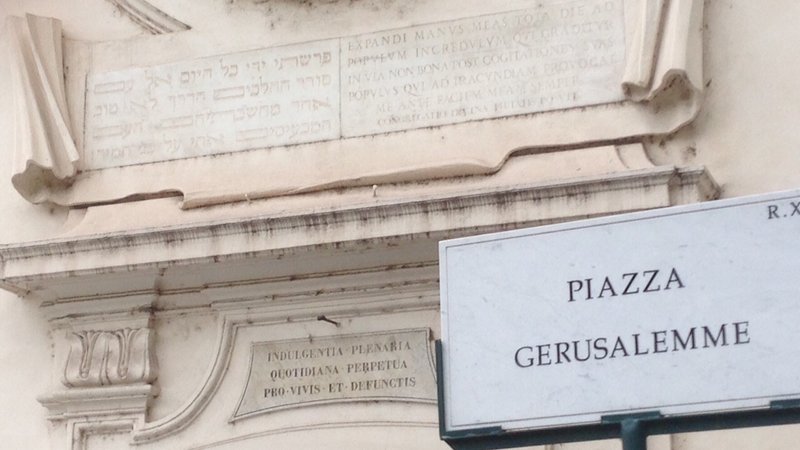 The façade of church San Gregorio Ai Quattro Capi, with inscription in Hebrew and Latin. The quote comes from the Old Testament Book of Isaiah, complaining about the obstinacy of Jews. By placing that quote there, Catholics distorted the meaning and used it to scold Jews for not converting to Christianity Sylvia Poggioli/NPR
