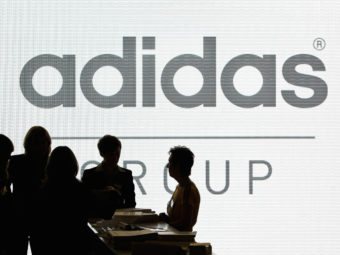 Adidas has pledged to help high school teams that want to change their mascots from Native American imagery. President Obama praised the effort, while the Washington football team shot back, calling the company's move hypocritical. Christof Stache/AP