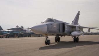 A Russian warplane taxies at Hemeimeem airbase in Syria. Advocates say a no-fly zone would keep Syrian aircraft from attacking anti-government rebels and endangering civilians, which might allow Syrians to feel safe enough to stay put. Vladimir Isachenkov/AP