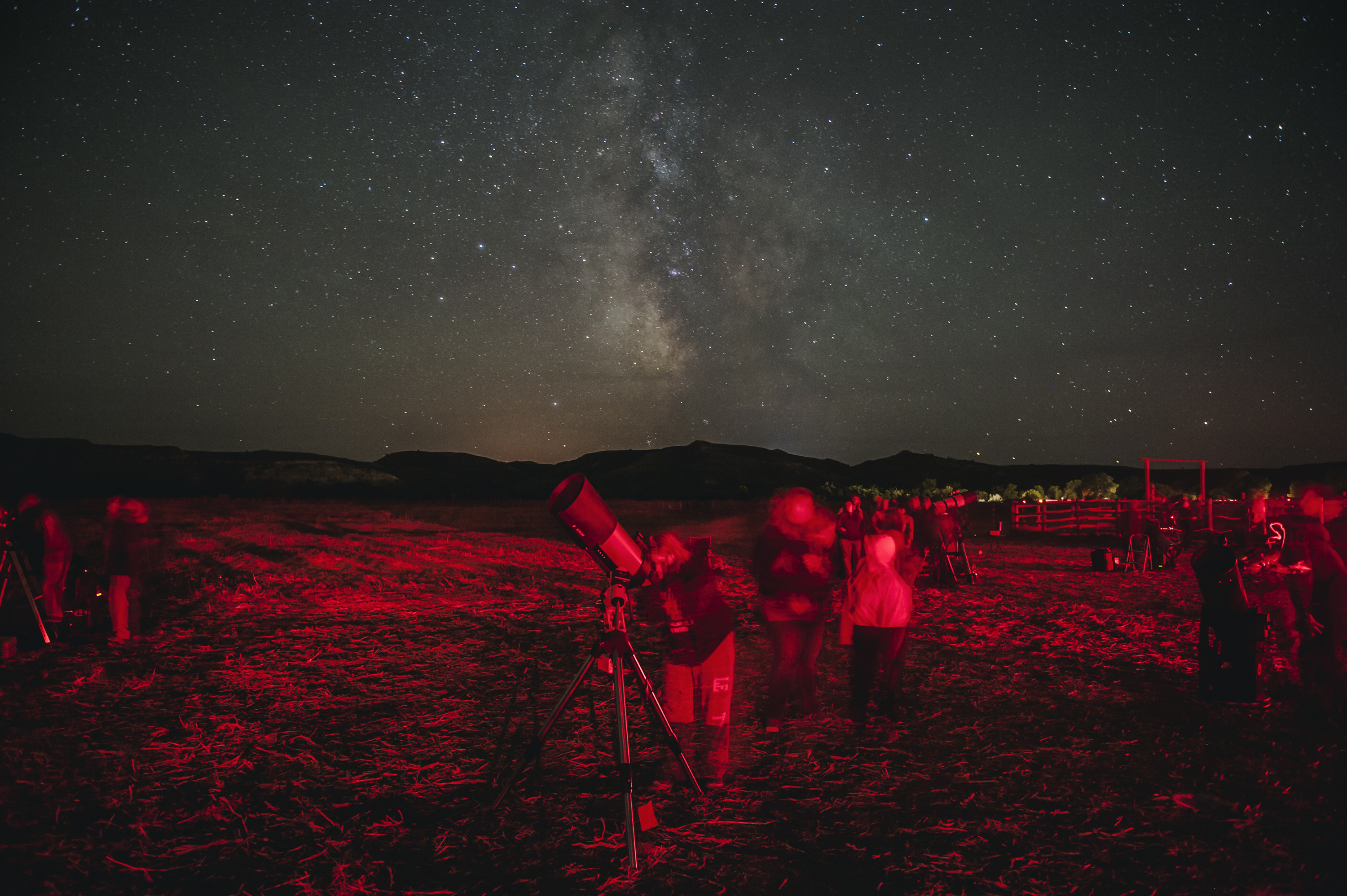 Star gazers flock to the south unit of Theodore Roosevelt National Park in western North Dakota for the annual Dakota Nights Astronomy Festival. Red lights were used during the event to help people move between telescopes without ruining their night vision. Between 2010 and 2013, the amount of non-natural light visible from the park increased by 500 percent, more than in any other national park. Andrew Cullen