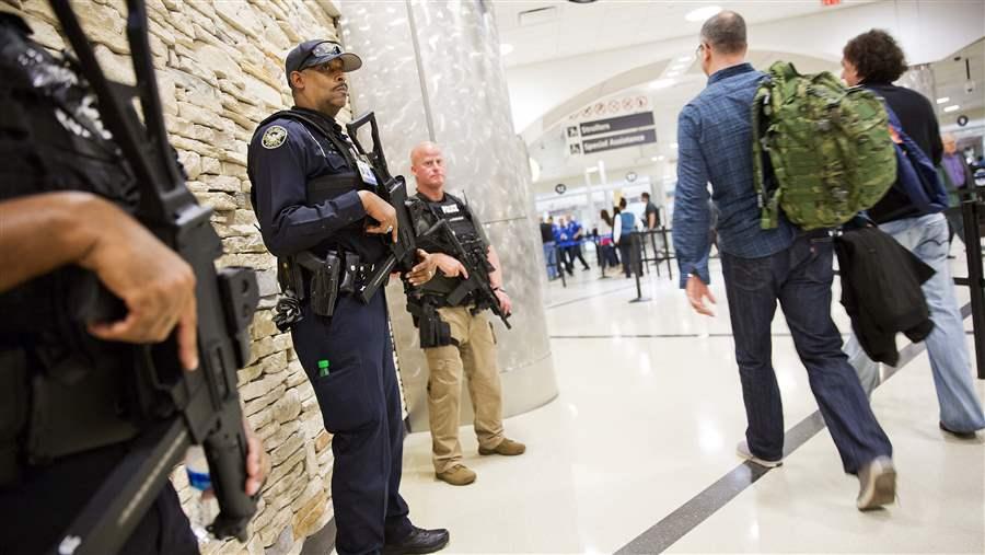 Heavily armed officers stand by a security checkpoint at Hartsfield-Jackson Atlanta International Airport after terrorist attacks in Paris. Experts say that smaller U.S. cities may lack the resources needed to prevent or react to an attack. AP