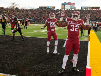 Arkansas running back Jonathan Williams had just scored a touchdown against Missouri last season when he dropped the ball and raised his hands in a hands up, don't shoot" gesture. L.G. Patterson/AP